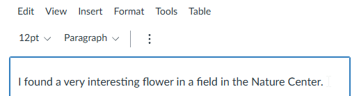 A document with a paragraph of text 'I found a very interesting flower in a field in the Nature Center'